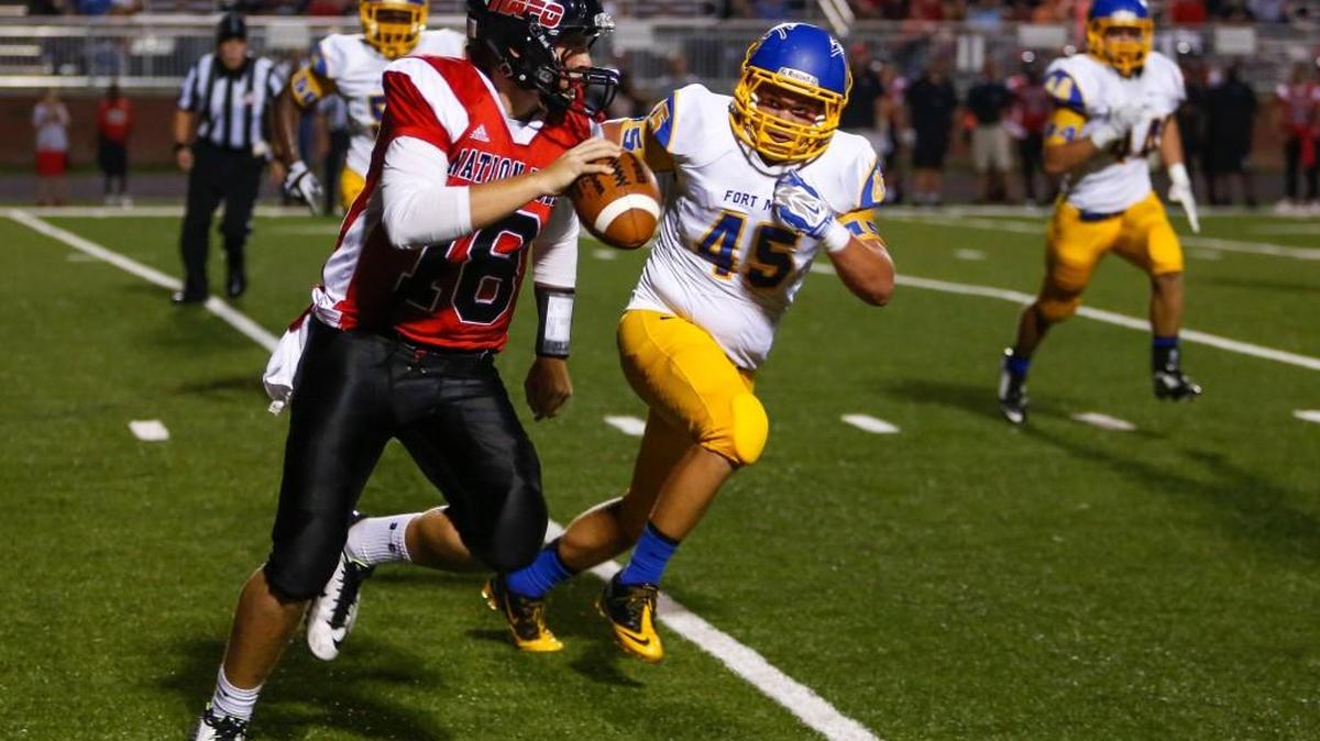 
Nation Ford's Cole Martin tries to get outside on the Fort Mill defense during the Falcons’ rivalry game against the Yellow Jackets in 2014.
