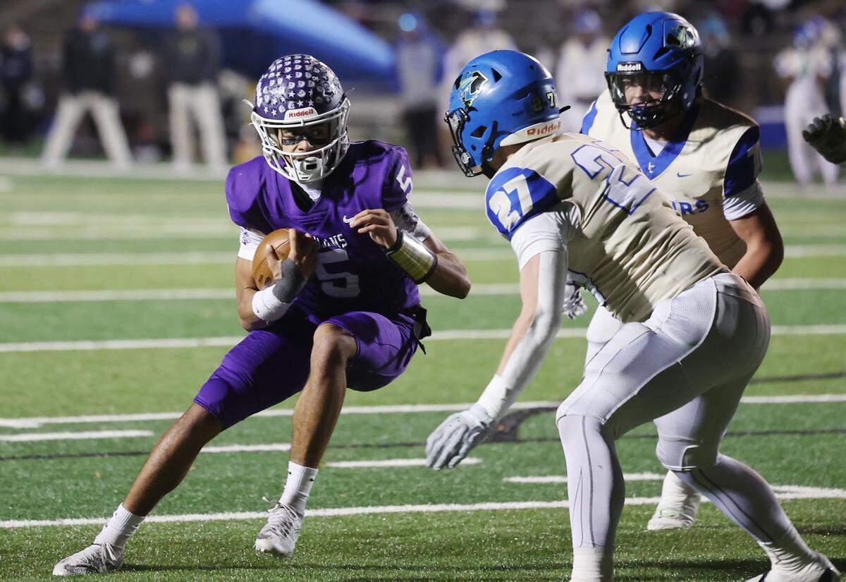 Northwestern's Xavier Means heads to the end zone as Indian Land's Jackson Headley tries to stop him on Friday, Nov. 28, 2025 in Rock Hill, South Carolina.