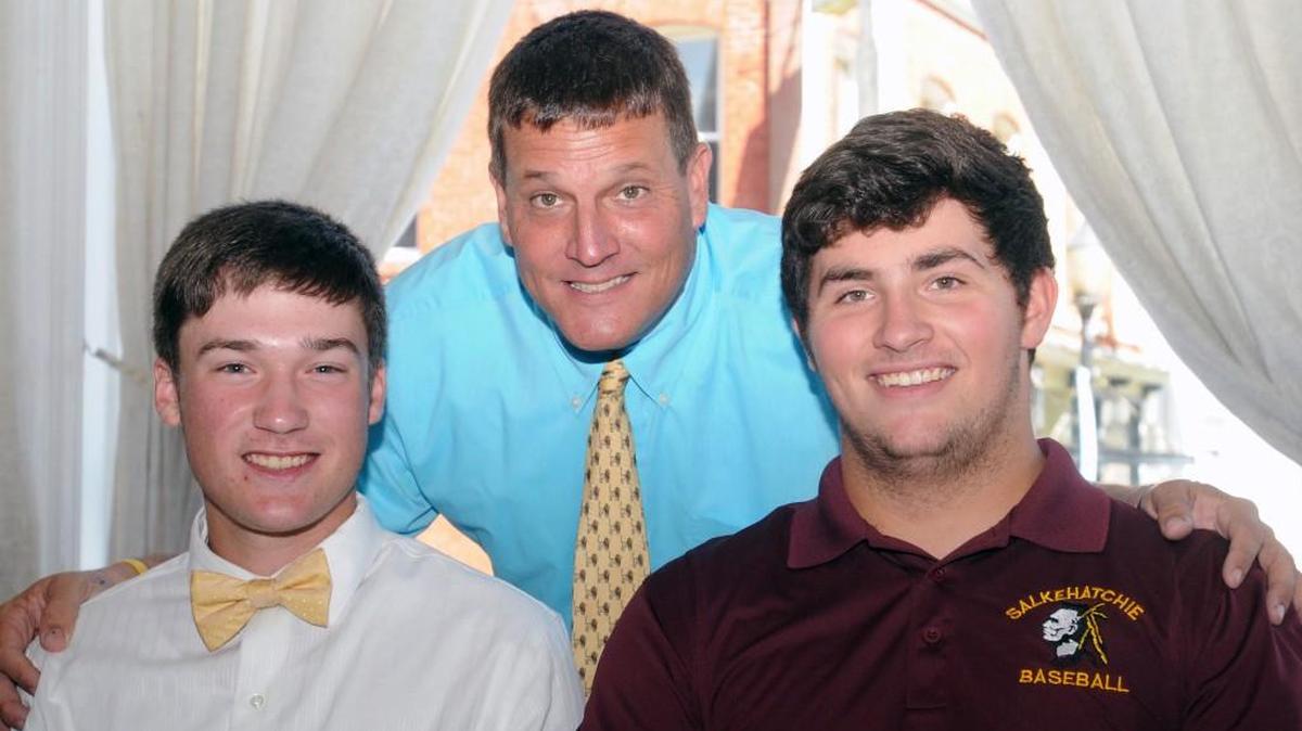 Lewisville’s Drew Stewart (left) and Denver Moseley were joined by Lions baseball coach Billy Keels on Wednesday during their college baseball signing ceremony in downtown Chester.