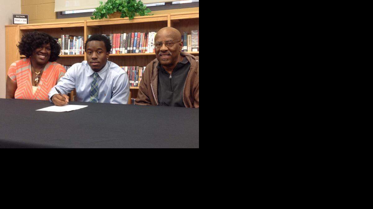 
York’s Armand Pendergrass was joined by his mother, Tonya, and his grandfather, Willie, during his signing ceremony Wednesday at the school. Pendergrass will play football at Greensboro College on a packaged full scholarship.

