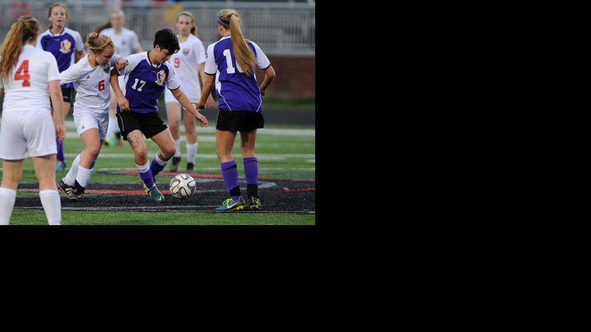 
Northwestern’s Christiana Means (17) tries to keep Nation Ford Falcon Emily Tobik (6) from getting the ball at center field.
