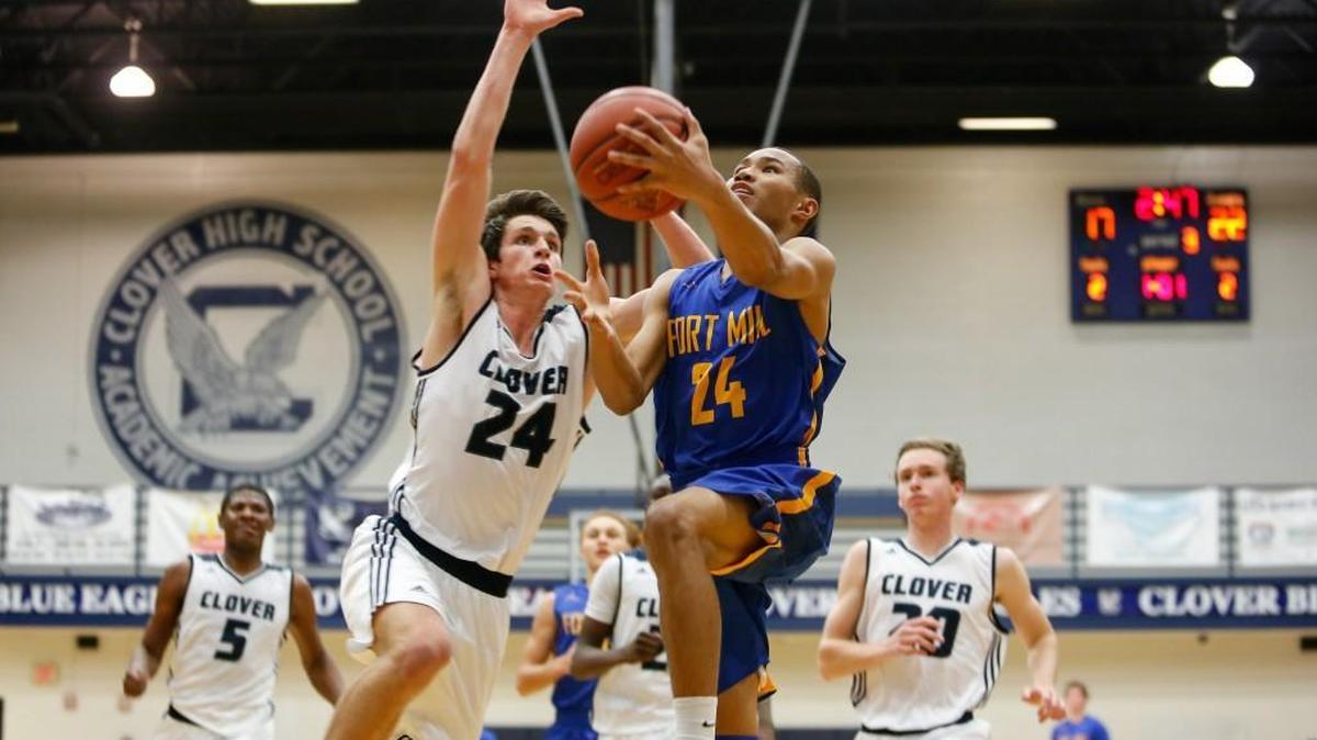 Fort Mill's No. 24 Kawan Walker muscles to the basket as Clover hosts Fort Mill in varsity boys basketball Tuesday, 2-2-2016.