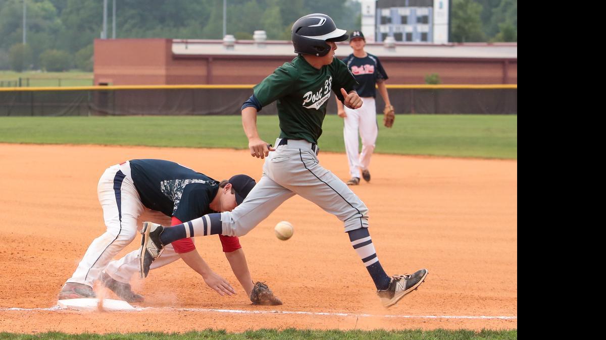 Clover's #16 Kyle Kalick crosses first base past an overthrown ball as Rock Hill Post 34 host the Clover Post 38 Lightning in American Legion Baseball 7-1-2015.