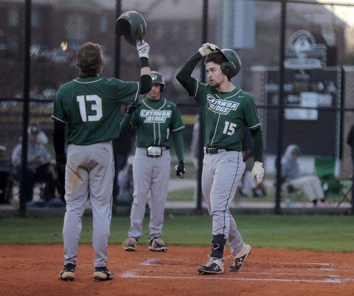 Catawba Ridge’s Harrison Wilson, right, and Jake McCoy celebrate after scoring Friday as the Copperheads take on the York Comprehensive Cougars in York.