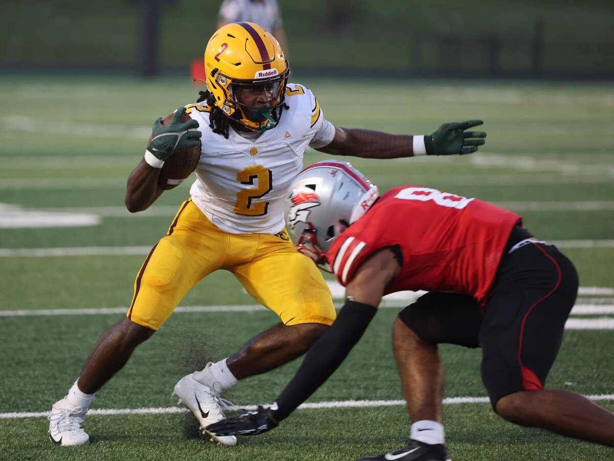 West Charlotte's Donte Nicholson tries to skirt around South Pointe's Kadin Watkins Friday, Sept. 5, 2025 in Rock Hill, S.C.