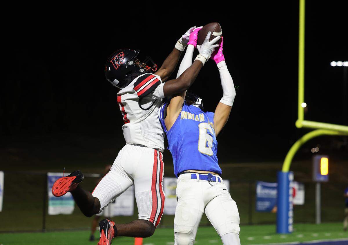 Indian Land's Noah Terry intercepts the ball against Nation Ford's Jayden Scott in their Oct. 3, 2025, game.