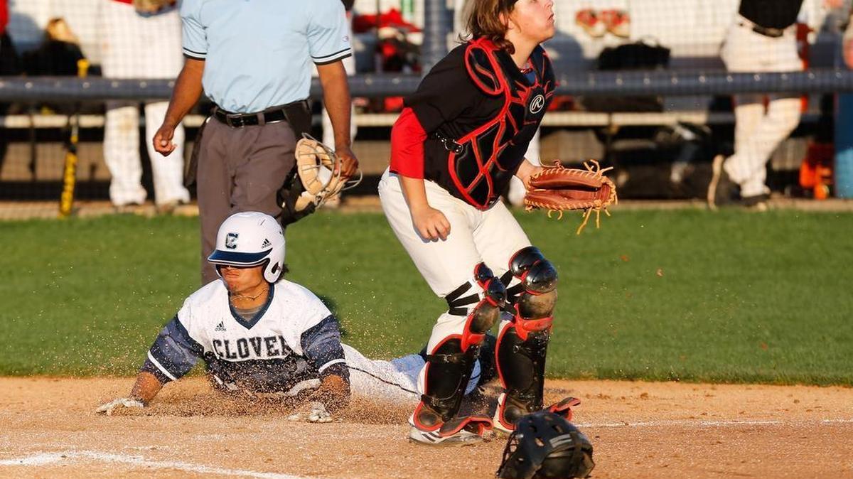 Clover's Noah Lindsay slides safe into home for a 3-0 lead as Clover hosts Hillcrest in playoff baseball. Lindsay took his game up a notch in the postseason.