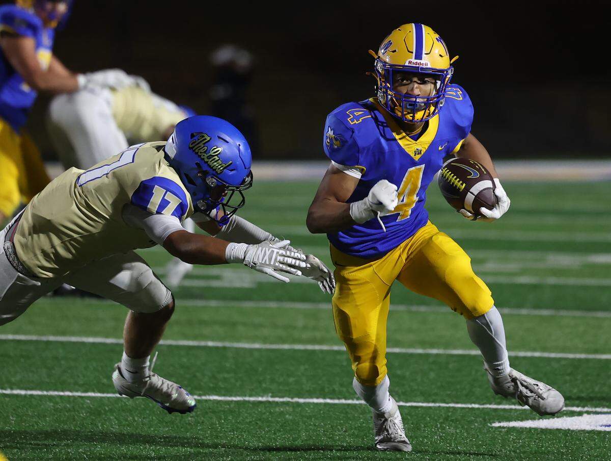 Fort Mill's Jameson Terrell carries the ball against Indian Land's Ty Fallecker Friday, Oct. 23, 2025 in Fort Mill, S.C.