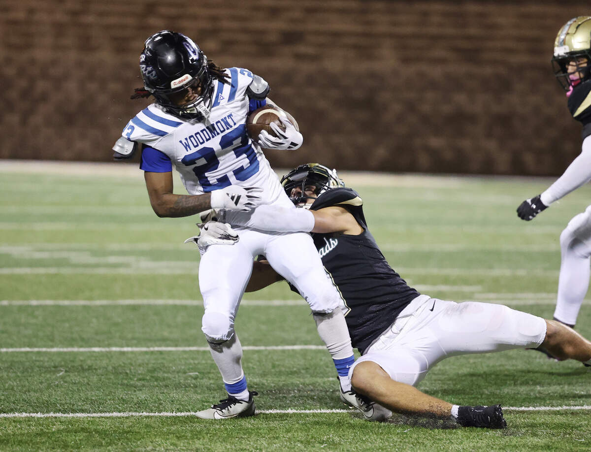 Catawba Ridge’s Nolan Jones pulls down Woodmont’s T.J. Williams during a 2024 game.