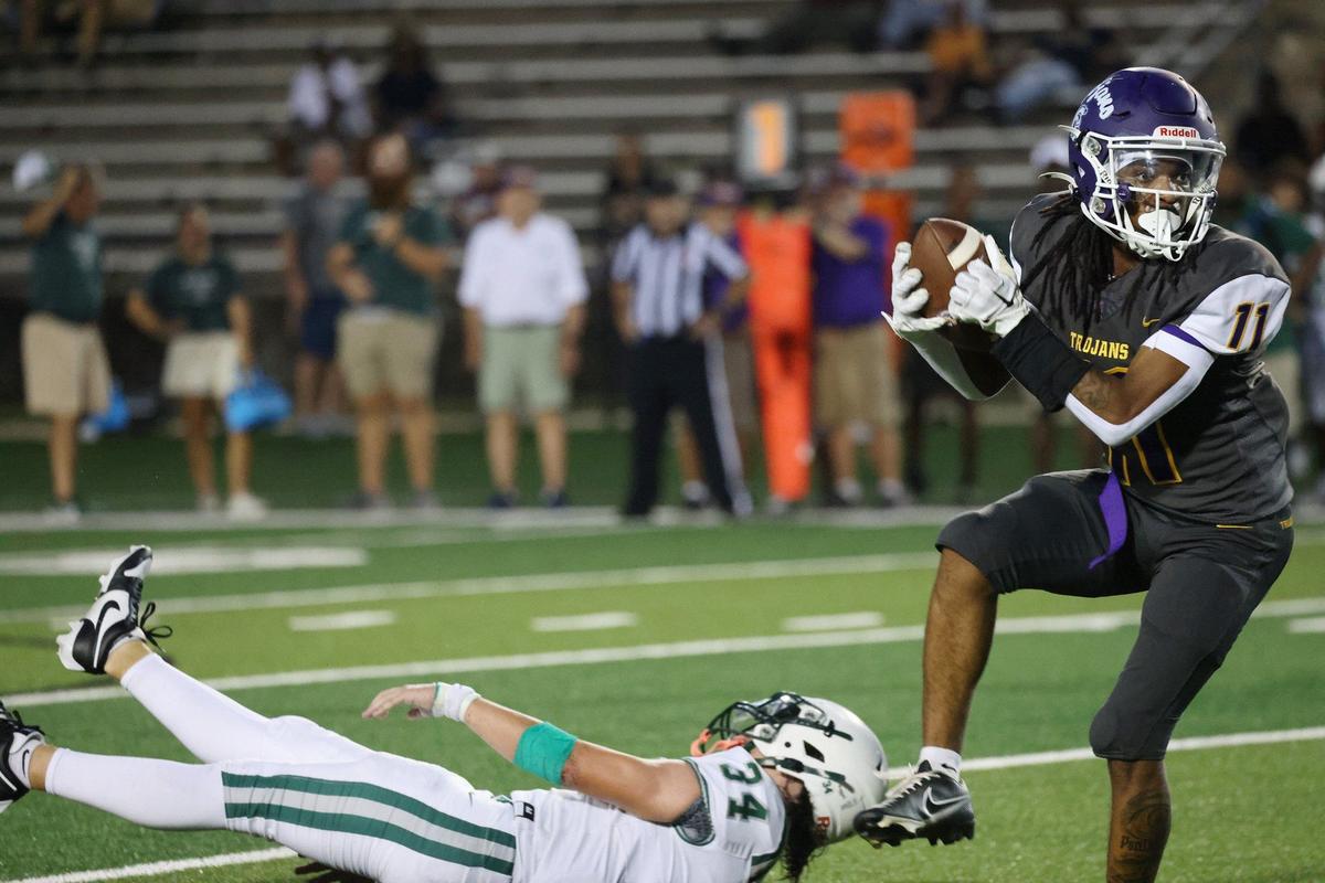 Northwestern’s Evan Harrison catches the ball Friday at the WRHI Football City USA scrimmage in Rock Hill.