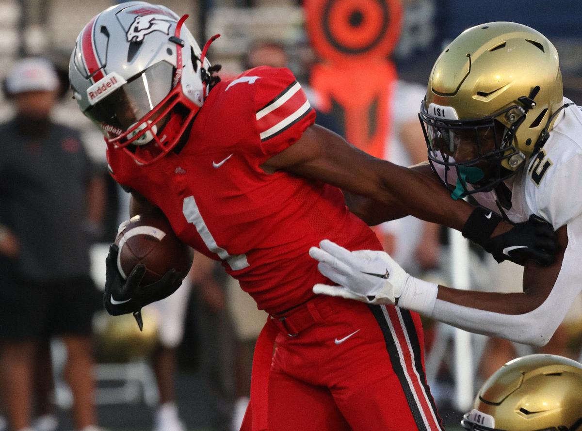 South Pointe’s Mason Hicks (1) is followed by Spartanburg’s Zy Williams-Bonds