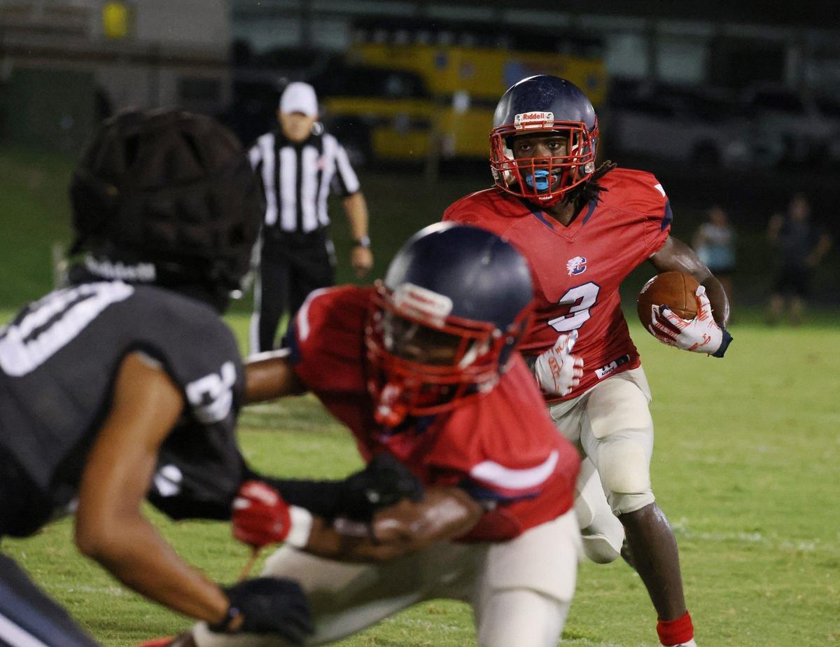 Chester’s Caleb Feaster carries the ball Friday at a scrimmage in Union.