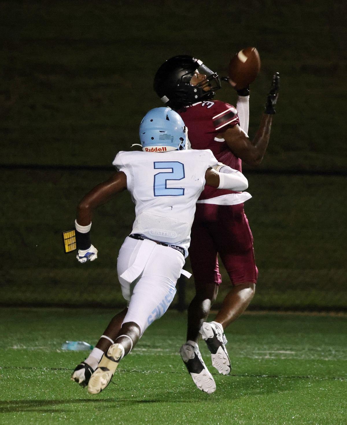 Rock Hill’s Malik Clark scores a touchdown as Hunter Huss’s Jakelon Littlejohn tries to stop him Friday at the WRHI Football City USA scrimmage in Rock Hill.