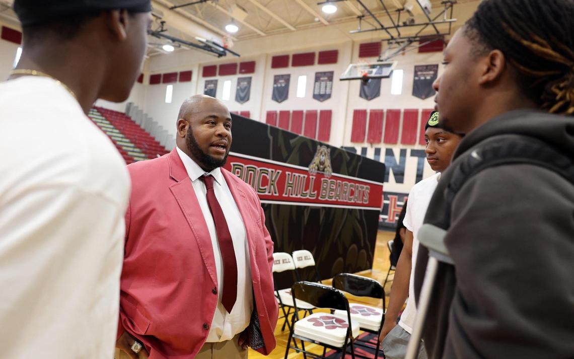 New Rock Hill High School head football coach Leon Boulware talks to his players Wednesday at the school, where he was introduced to the community.