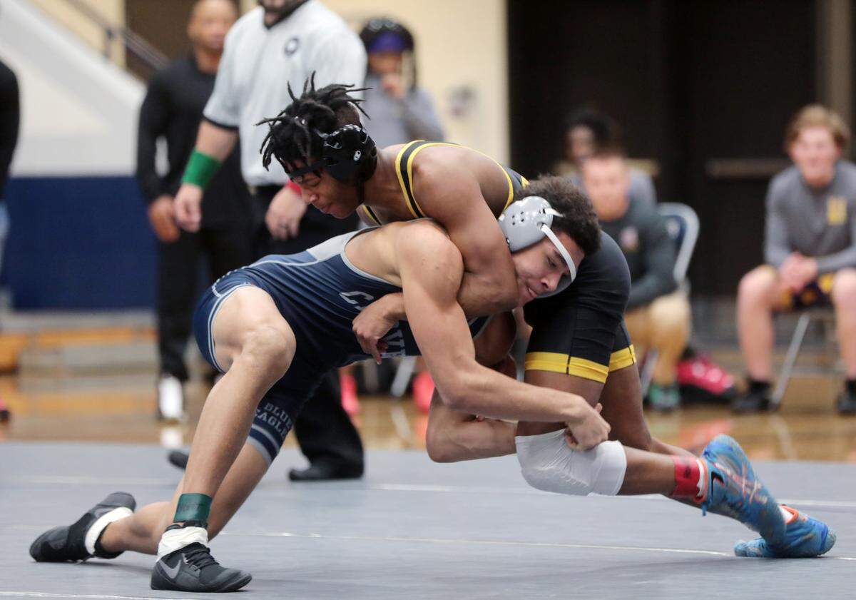 Clover’s Jadyn Bryant and Kamarien Barnette compete in the 170-pound weight class.