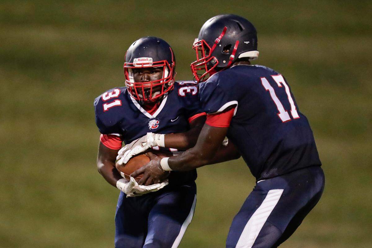 Chester quarterback (17) Zan Dunham hands off to Chester’s (31) Shydem McCullough in first half play as Chester hosts Northwestern in Friday night football 9-10-2021. McCullough was voted as a Week 6 Player of the Week by the Tri-County Coaches Association.