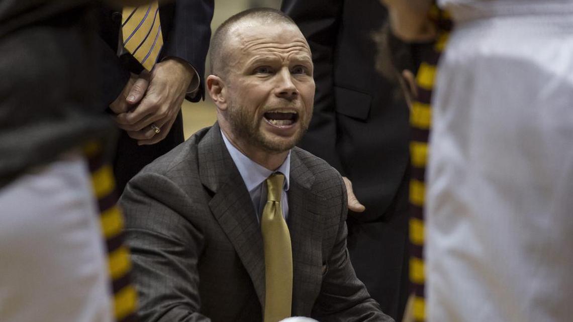 Winthrop basketball coach Pat Kelsey talks to his players during a timeout in a 2018 game.