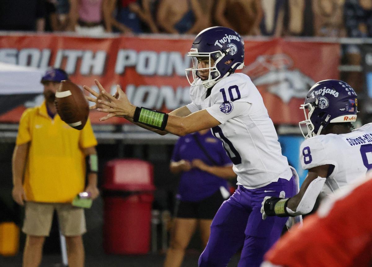 Northwestern’s Finley Polk captures the ball Friday as the Trojans competed with the South Pointe Stallions in Rock Hill.