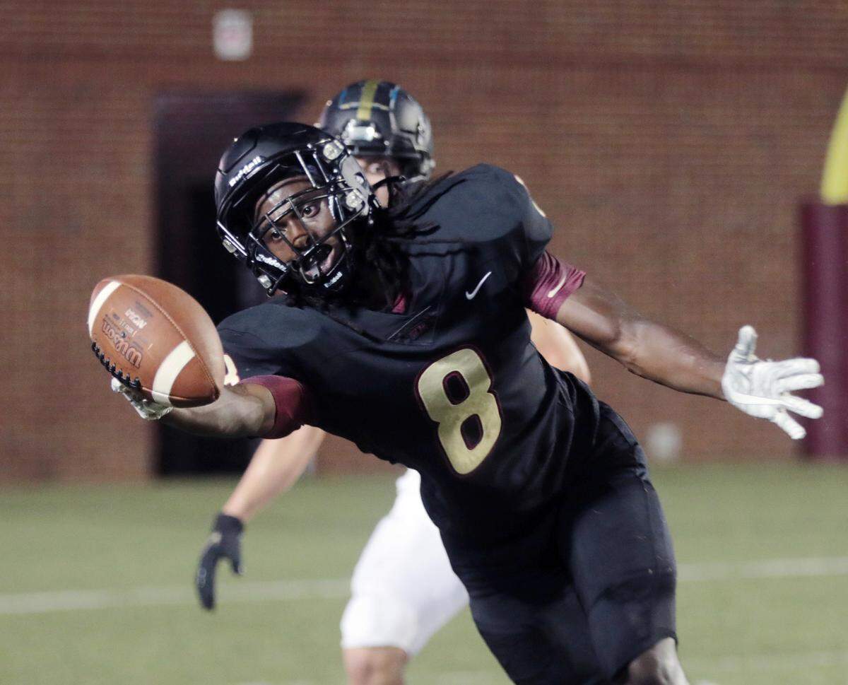 Rock Hill’s Buck Peay reaches for the ball Friday during the WRHI Kickoff.
