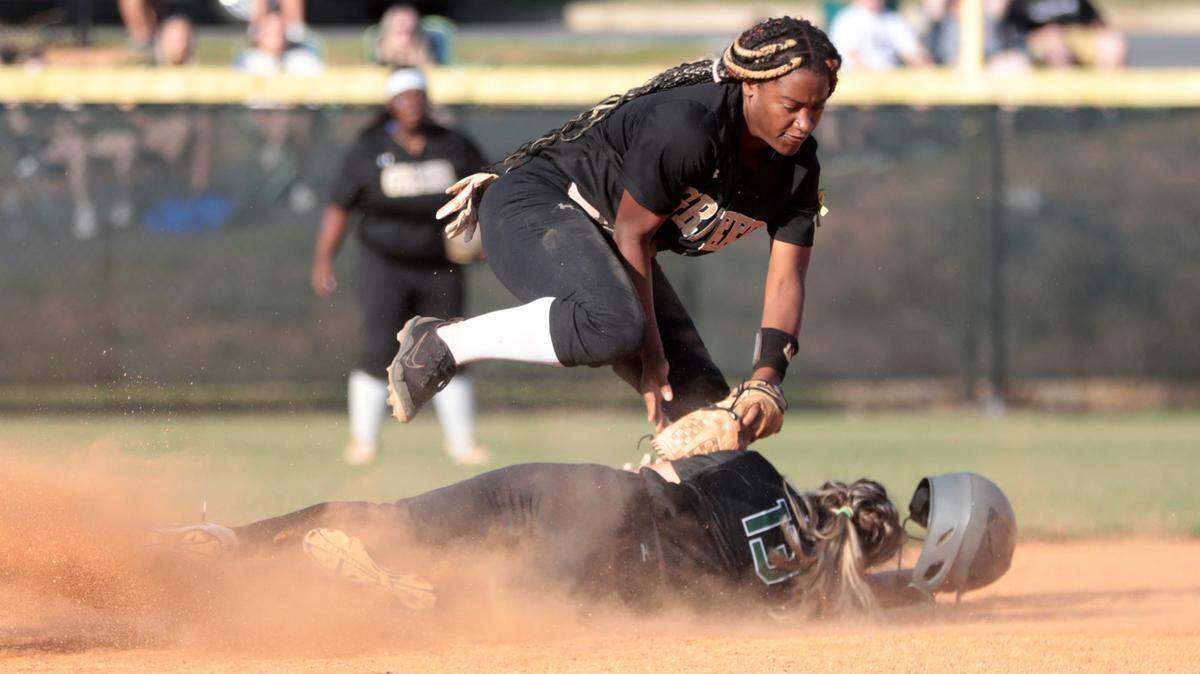 Greer’s Kristen Griffin tags Janelle Ilacqua out at second base Friday at Catawba Ridge High School.