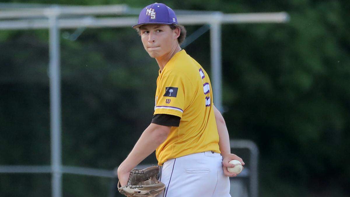 Northwestern pitcher Owen Sarna looks back to first base