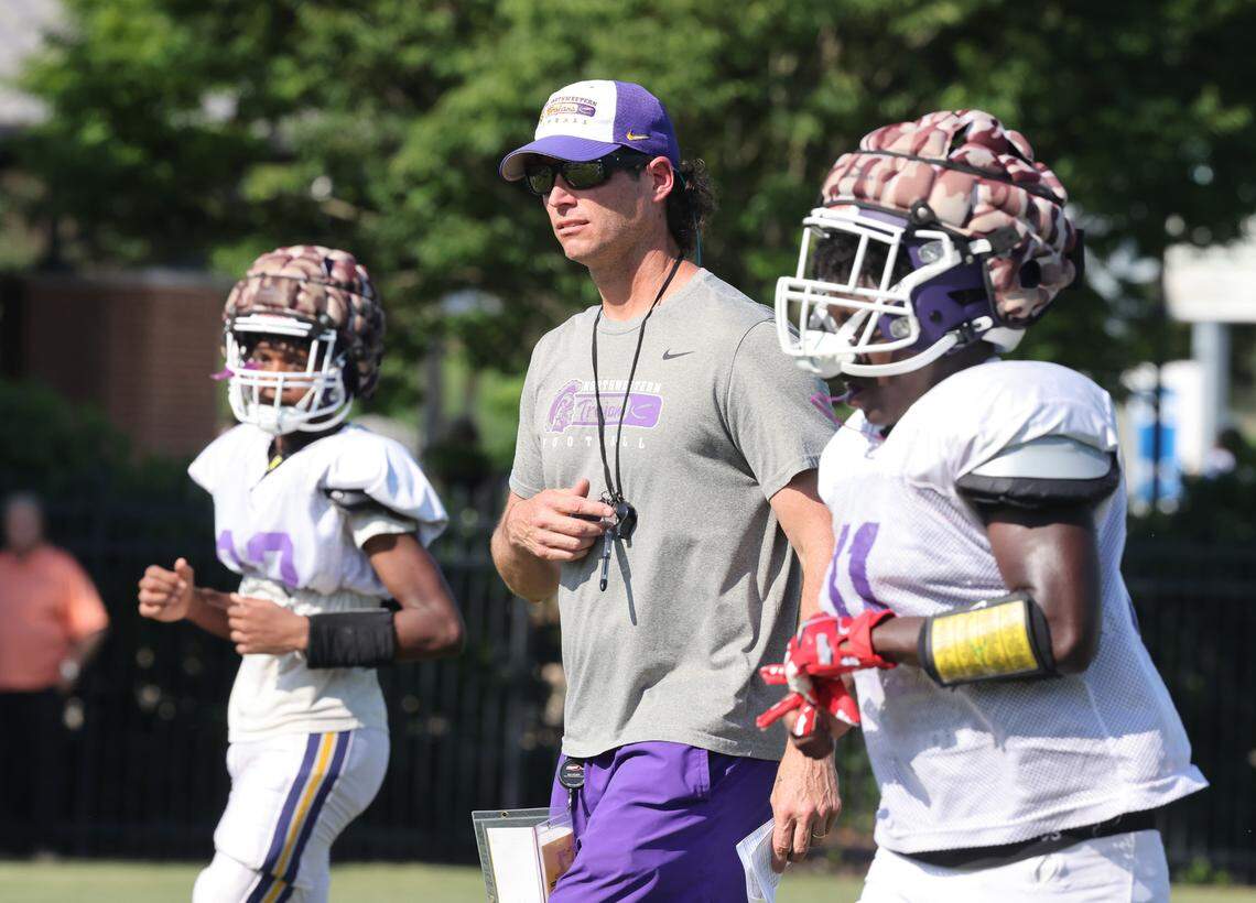 Northwestern High School head football coach Page Wofford watches his team practice Tuesday at Manchester Meadows.