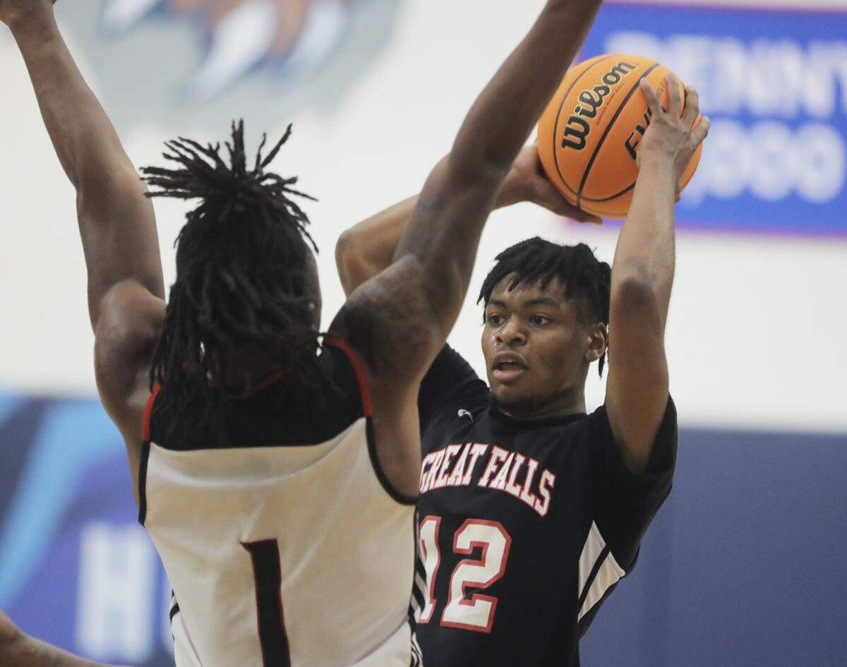Great Falls’ Xavier Brown looks for an opening against Calhoun County’s Russell Brunson Jr.