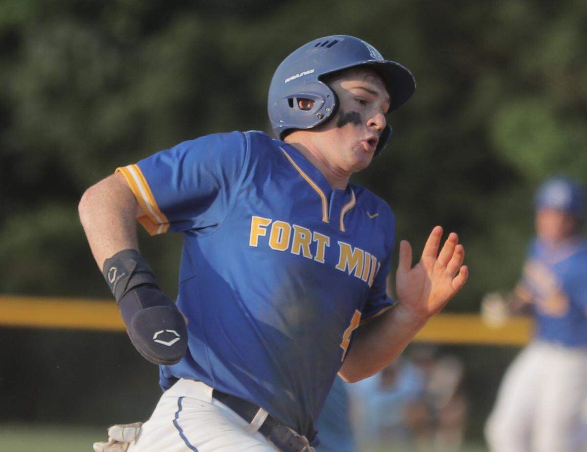 Fort Mill’s Eli Craddock rounds third base on his way to home plate.