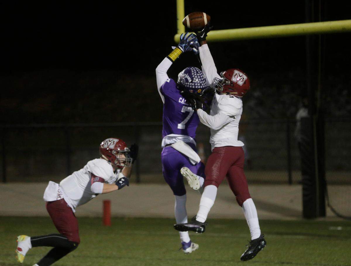 Northwestern’s Elijah Caldwell (7) and Westside’s Joshua Williams miss the ball in the endzone during the quarterfinals of the 4A state playoffs Friday night
