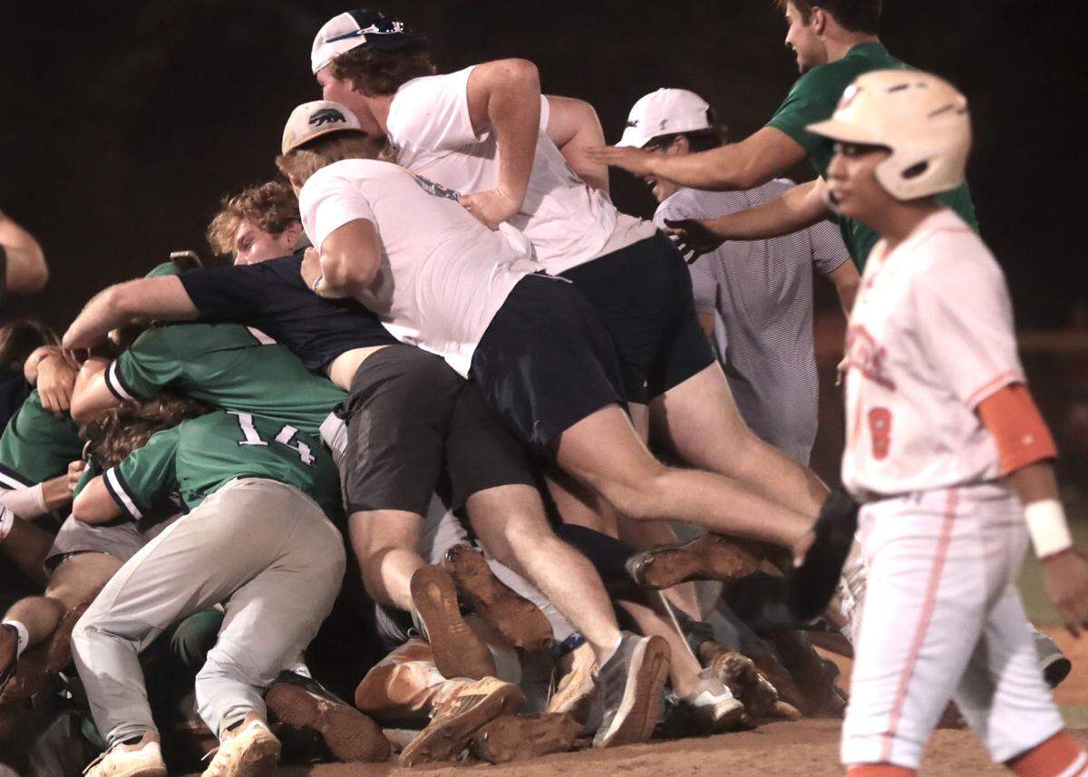 The Legion Collegiate Academy baseball team celebrates after winning the school’s first baseball championship title Tuesday in Lancaster