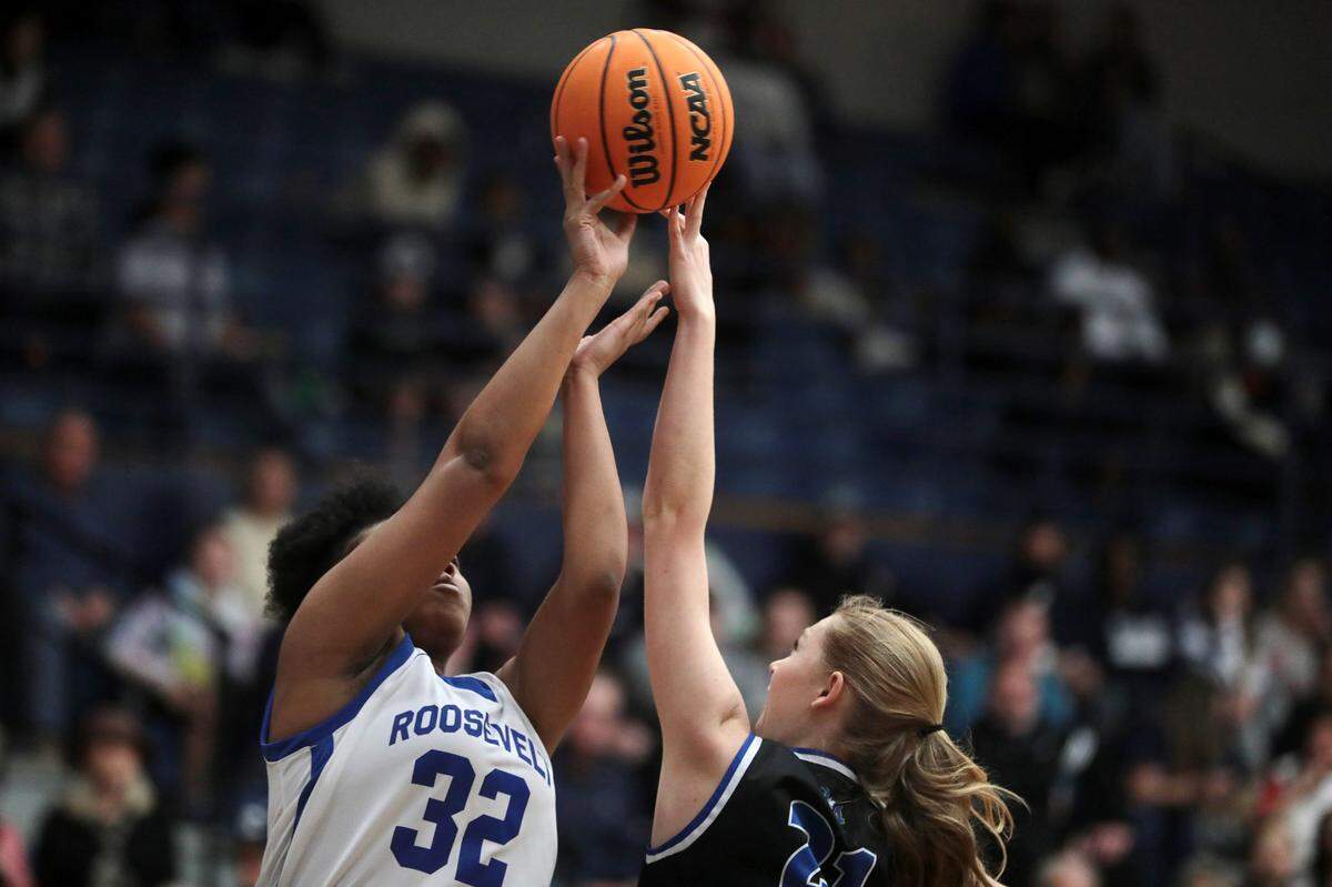 Clover’s Samora Lucas, left, blocks the shot of Fort Mill’s Sienna Lydon.