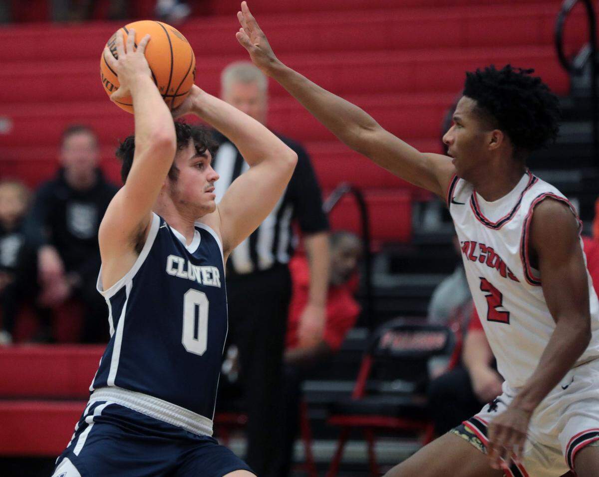 Clover’s Dylan Rupert (0) tries to pass the ball around Nation Ford’s J.J. Rembert.