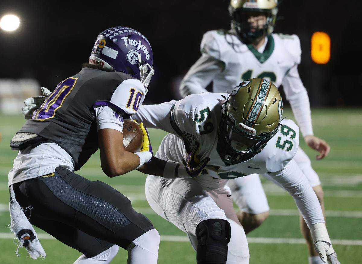 Northwestern High School's Jayden Baxter (10) tries to ward off Catawba Ridge's Colin Howe Friday, Nov. 14, 2025 in Rock Hill, S.C.