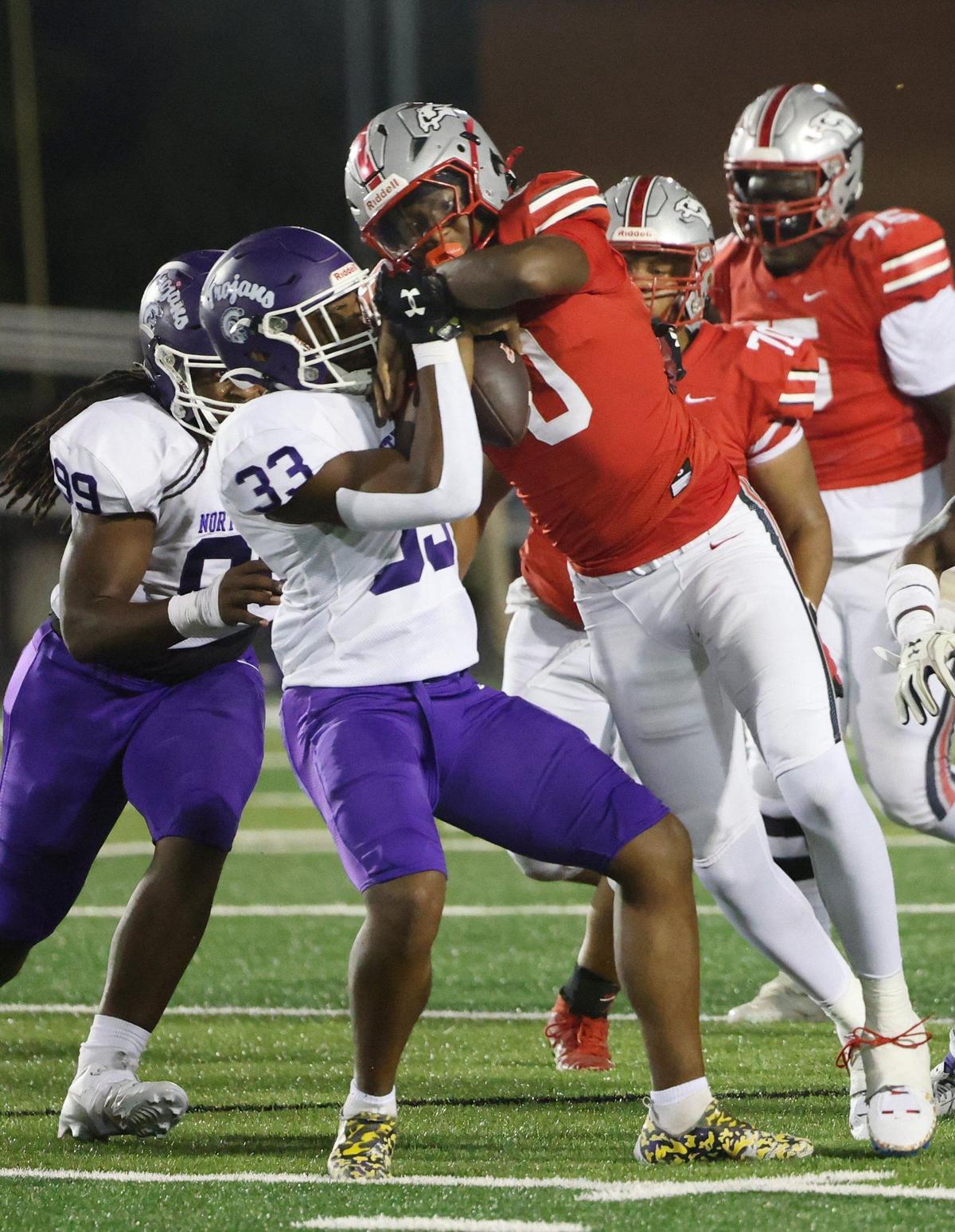 South Pointe’s J’zavien Currence (0) and Kamerin Mcfadden (33) compete for the ball.