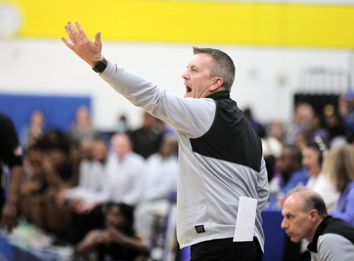 Fort Mill High School boys basketball coach Dwayne Hartsoe yells to his team Monday as the Yellow Jackets take on the Ridgeview High School Blazers in Fort Mill.