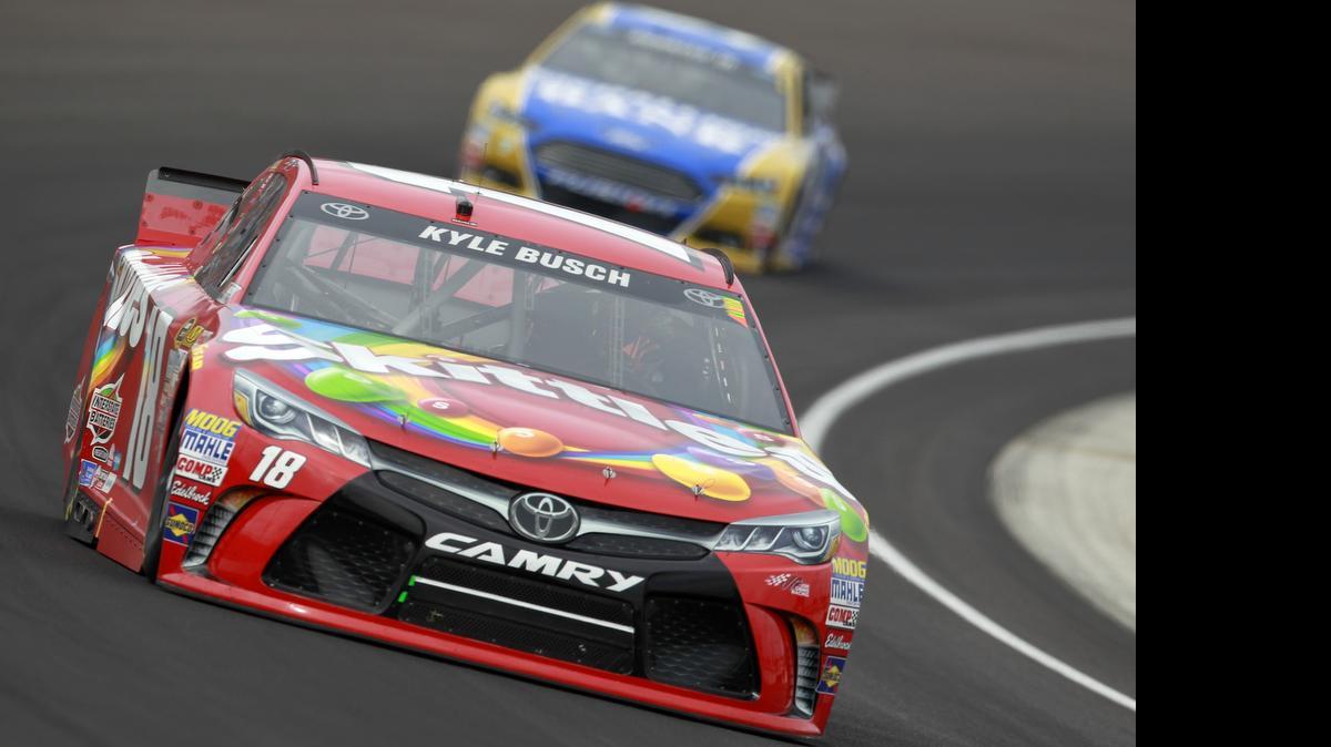
Kyle Busch leads a pack of cars during the NASCAR Sprint Cup Series Crown Royal Presents the Jeff Kyle 400 at the Brickyard at Indianapolis Motor Speedway on July 26, 2015 in Indianapolis.

