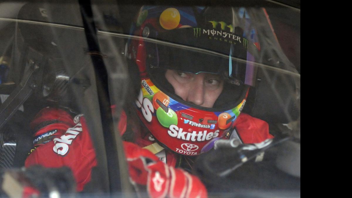 
Kyle Busch waits in his car before practice for the Coca-Cola 600 Sprint Cup series auto race at Charlotte Motor Speedway in Concord on Thursday.

