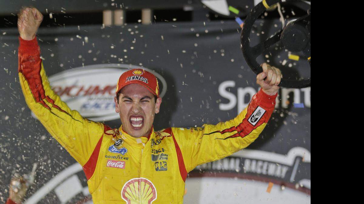 
Joey Logano celebrates his win in the NASCAR Sprint Cup auto race at Richmond International Raceway in Richmond, Va., on April 26, 2014.
