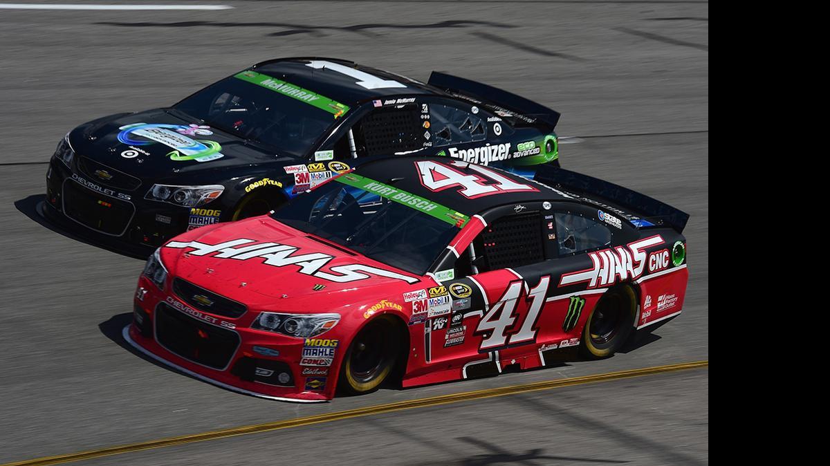 
Jamie McMurray and Kurt Busch race during the NASCAR Sprint Cup Series Toyota Owners 400 at Richmond International Raceway on April 26, 2015 in Richmond, Va.
