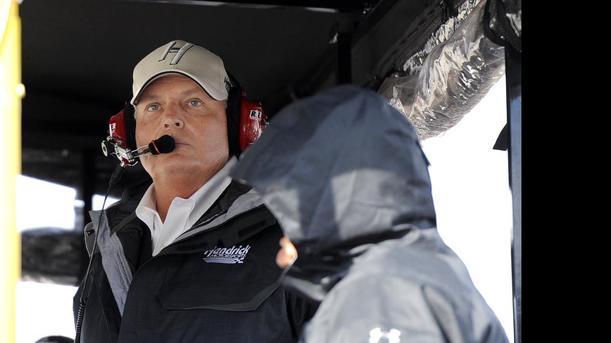 
Rick Hendrix, owner of Hendrix Motorsports, watches the final laps of a 2014 NASCAR Sprint Cup Series auto race at Martinsville Speedway. 
