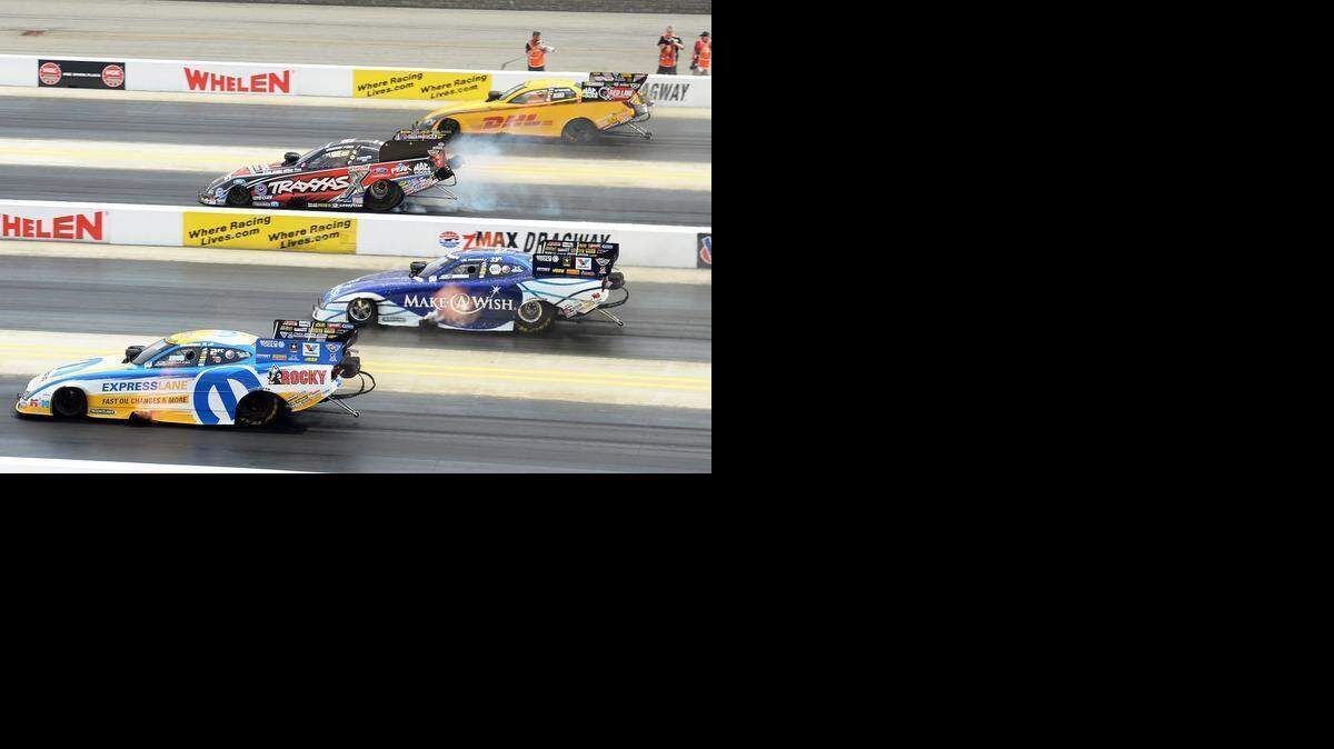 
Matt Hagan, bottom, won the 2013 Funny Car title at the Four-Wide Nationals in Concord and claimed a second division championship last year.
