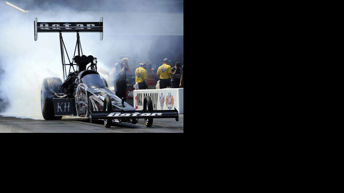 
In this photo provided by NHRA, defending NHRA Mello Yello Top Fuel world champion Shawn Langdon secures the No. 1 qualifying position in his Al-Anabi Racing dragster at the fifth annual NHRA Four-Wide Nationals Saturday, April 12, 2014, at zMAX Dragway in Concord.
