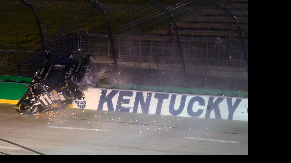 
Ben Kennedy crashes into the fence and wall during the NASCAR Camping World Truck Series UNOH 225 at Kentucky Speedway on Thursday, July 9, 2015 in Sparta, Ky.
