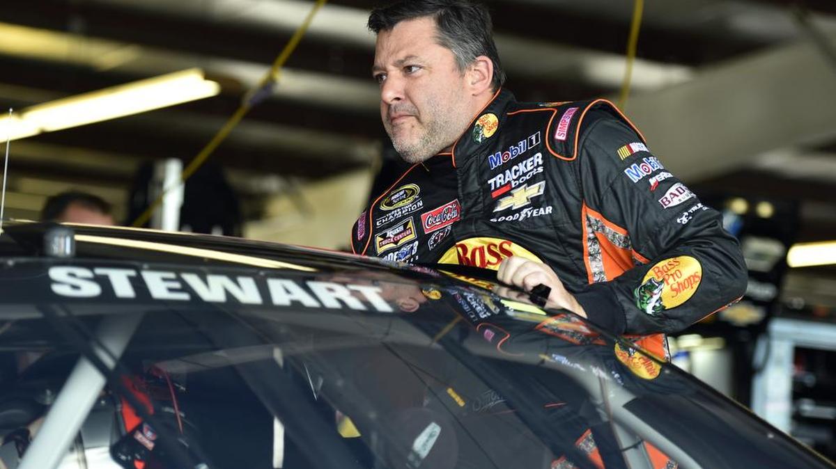 
Tony Stewart climbs into his car before practice for Sunday’s NASCAR Sprint Cup Series race at Watkins Glen International, on Friday. A wrongful-death lawsuit has been filed in the death of Kevin Ward, a sprint car driver who was killed in a 2014 incident in upstate New York. 
