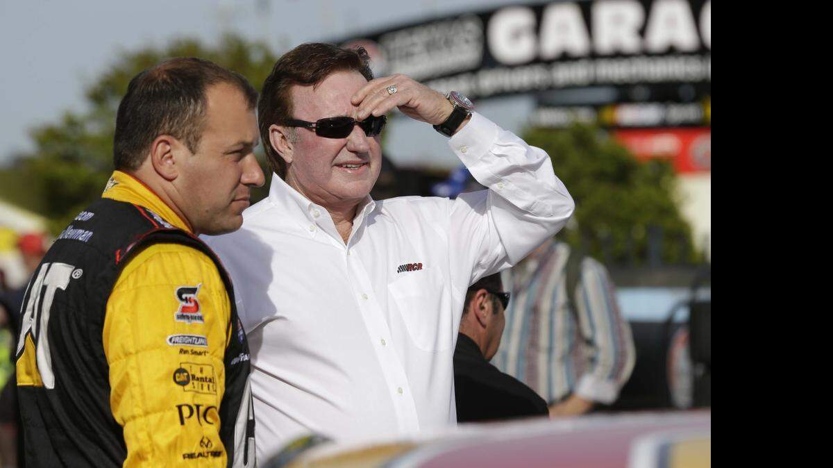 
Team owner Richard Childress, right, chats with driver Ryan Newman before qualifications for Saturday's Sprint Cup auto race at Texas Motor Speedway in Fort Worth, Texas, April 10, 2015. 
