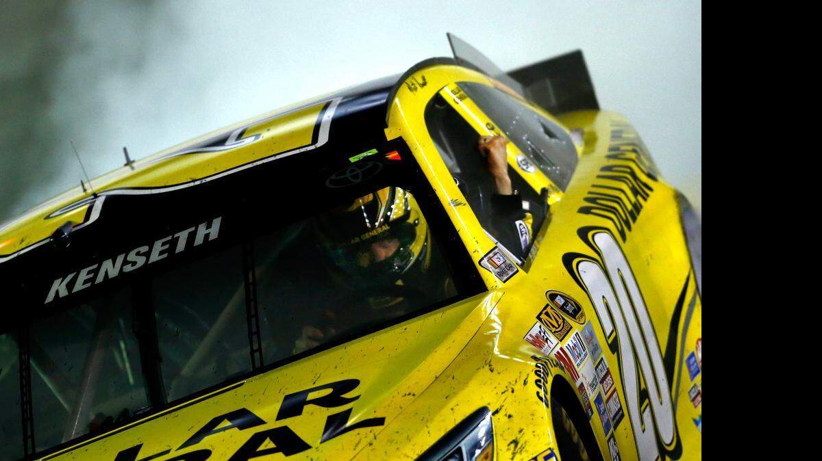 
Matt Kenseth celebrates with a burnout on Sunday after winning the NASCAR Sprint Cup Series Food City 500 at Bristol Motor Speedway in Bristol, Tenn.
