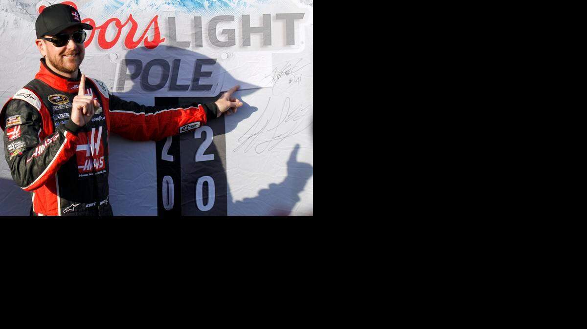
Driver Kurt Busch poses after winning the pole for Sunday's NASCAR Sprint Cup Series auto race in Fontana, Calif., Friday, March 20, 2015. 
