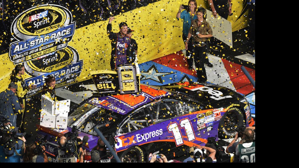 
Denny Hamlin celebrates his win in Saturday night’s NASCAR Sprint All-Star Race at Charlotte Motor Speedway in Concord.
 
