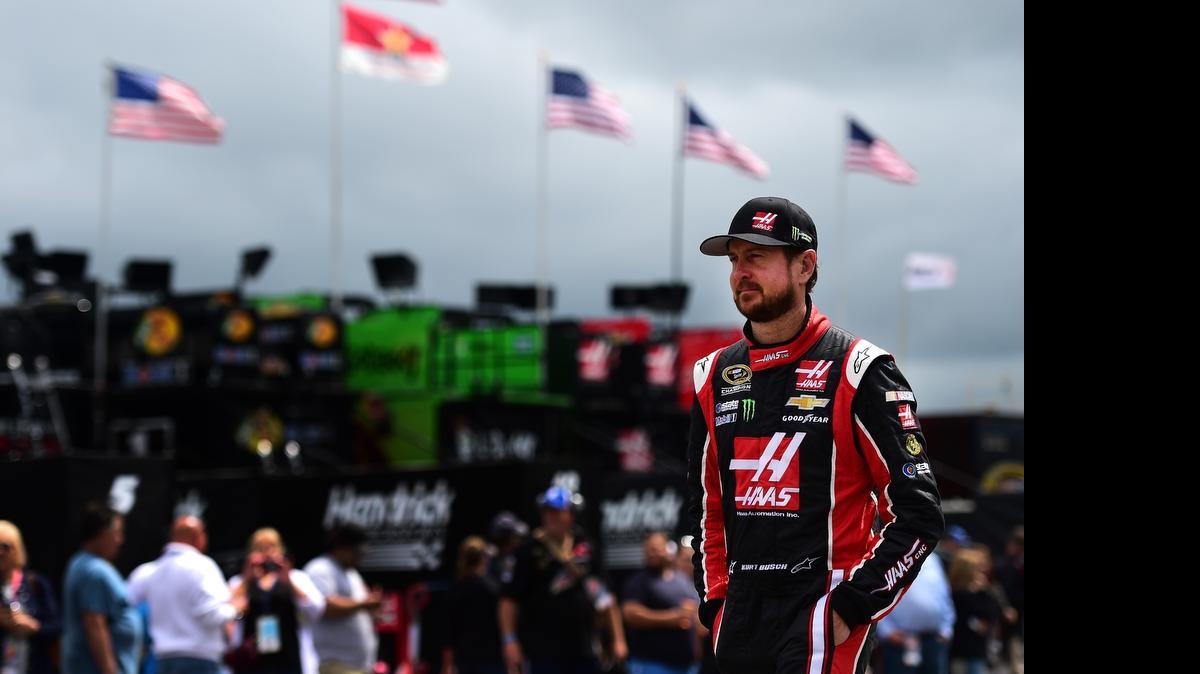 
Kurt Busch walks through the garage area during practice for the NASCAR Sprint Cup Series Axalta 'We Paint Winners' 400 at Pocono Raceway on June 6, 2015 in Long Pond, Pa.
