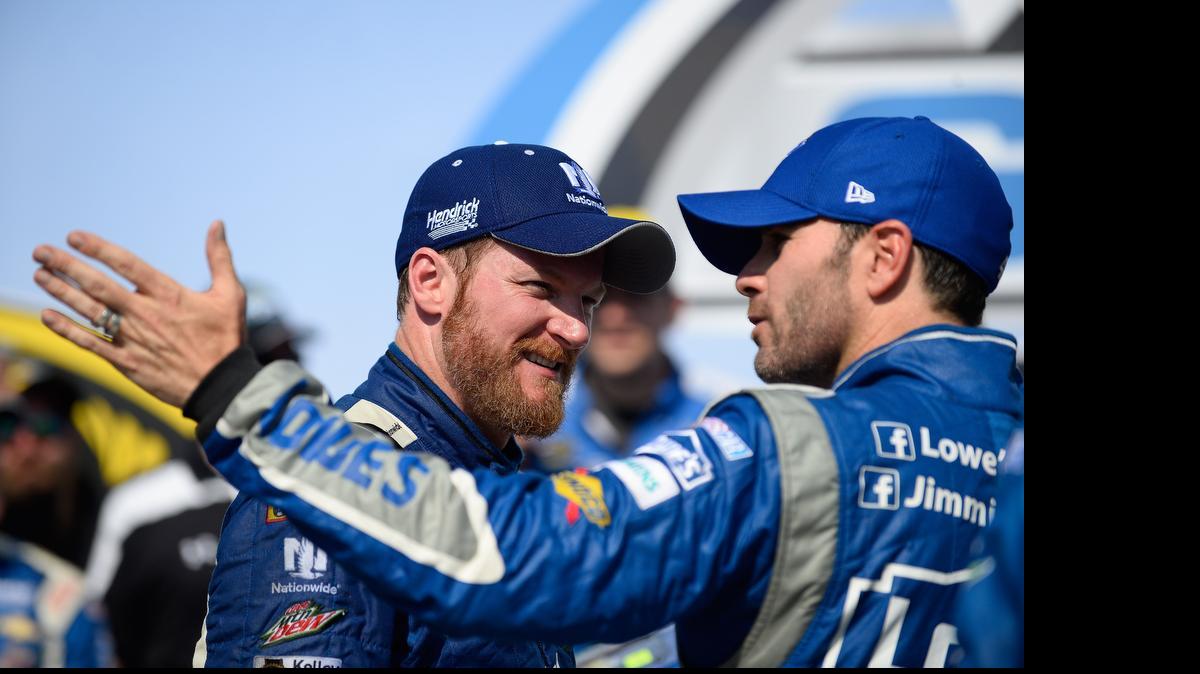 
Dale Earnhardt Jr., left, talks with Jimmie Johnson in Victory Lane after the Talladega 500 NASCAR Sprint Cup race at Talladega on Sunday. Some fans have theorized Johnson didn’t do enough to try to pass Earnhardt, but Johnson disagrees. 
